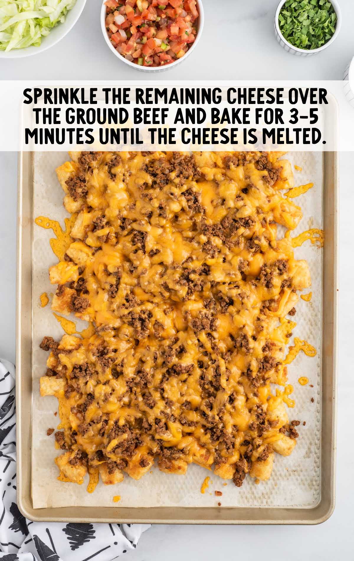 cheese sprinkled on top of the ground beef