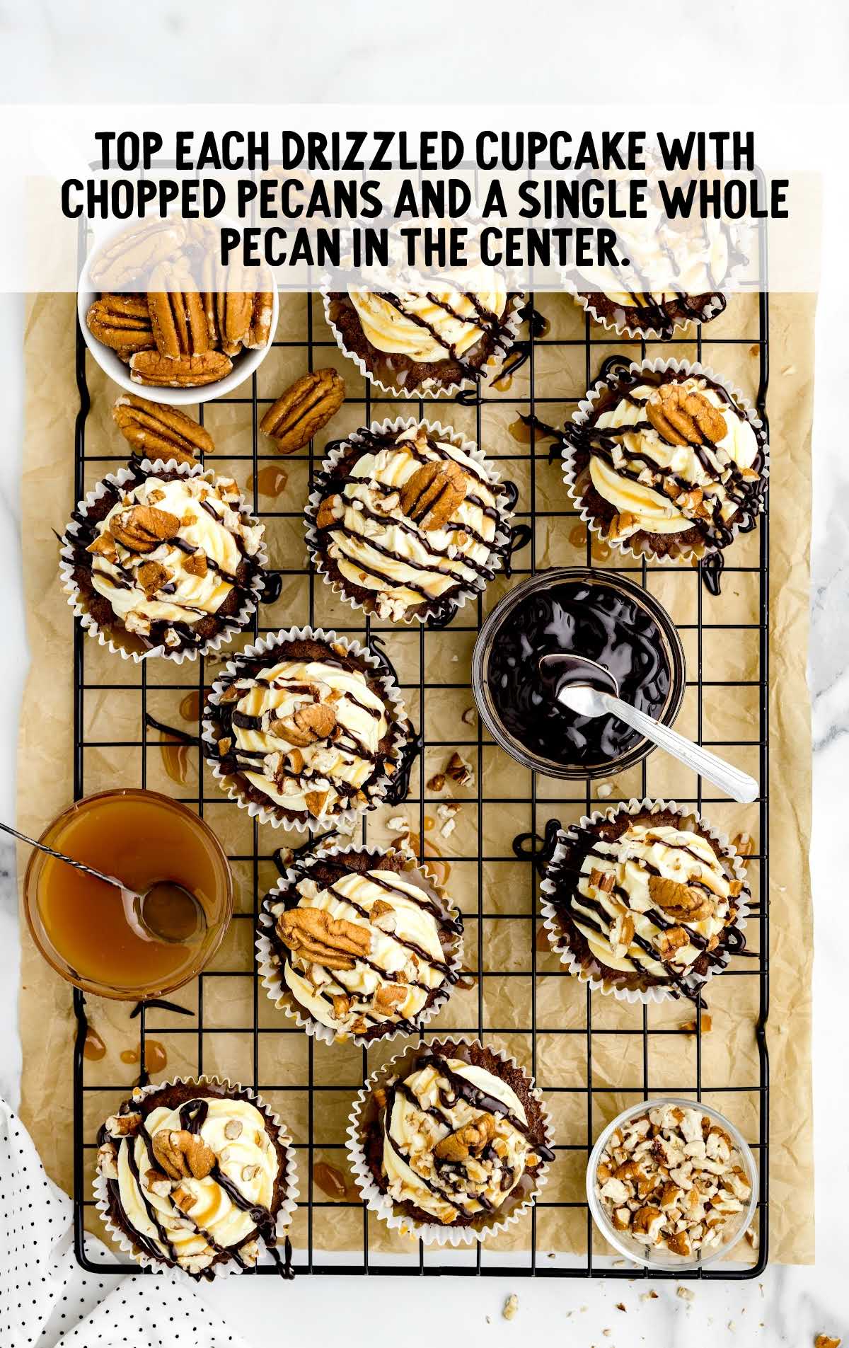 chopped pecans drizzled on top of each cupcake and place a single pecan on top