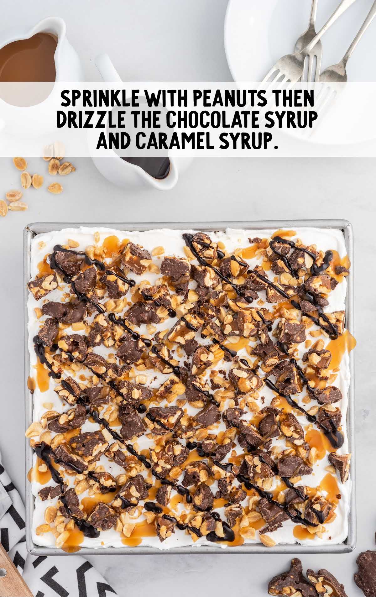 peanuts sprinkled and chocolate syrup and caramel syrup drizzled on top