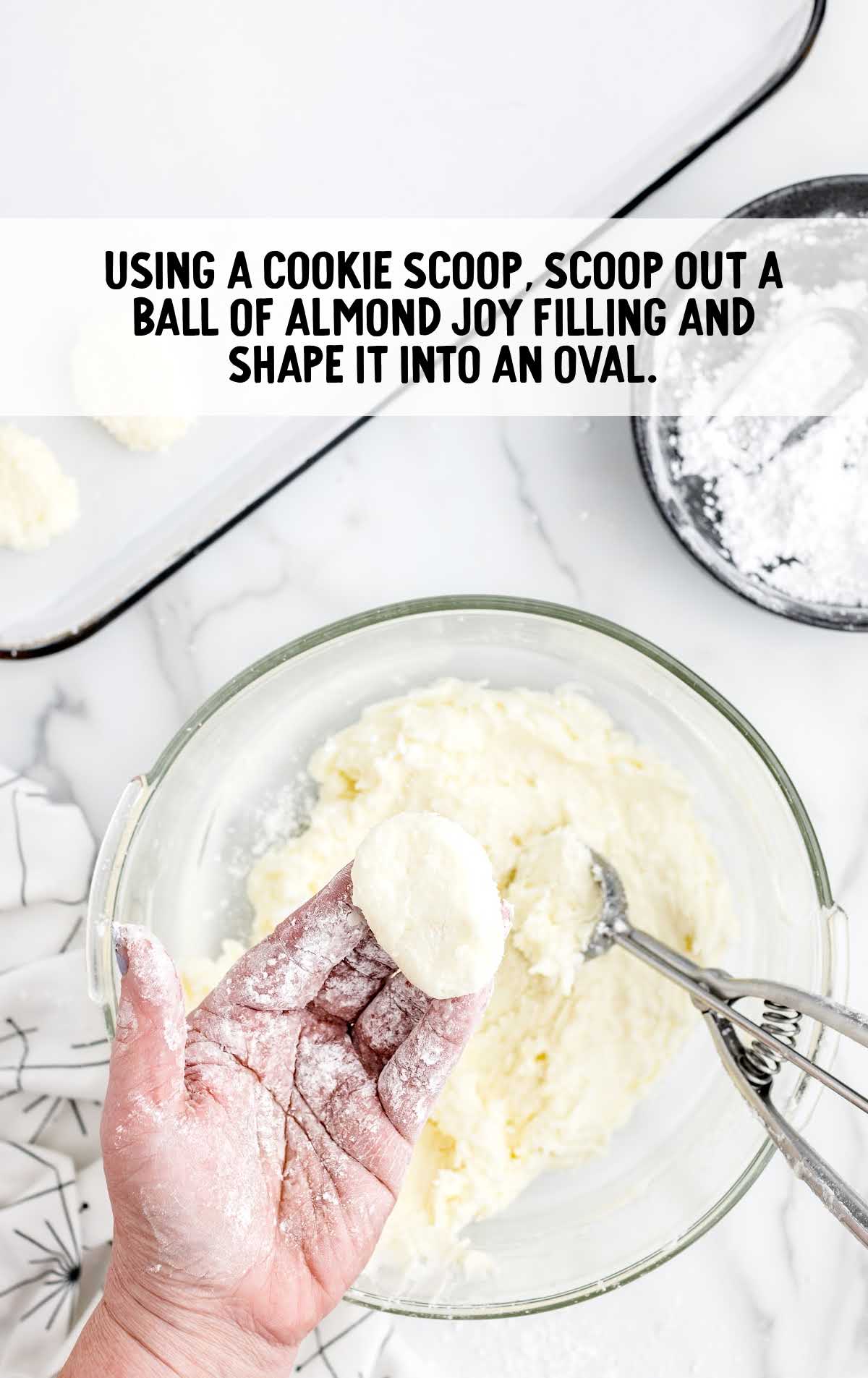 scoop out almond joy filling and shape it into an oval