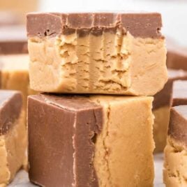 a close up shot of Buckeye Fudge stacked on top of each other with a bite taken out of it