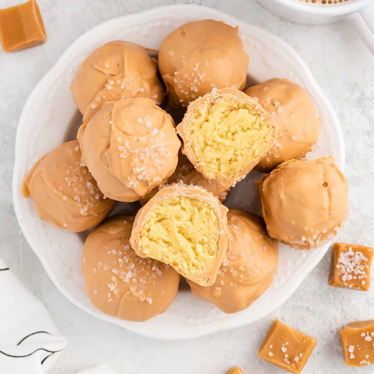 overhead shot of Caramel Cheesecake Bites with one split in half on on a plate