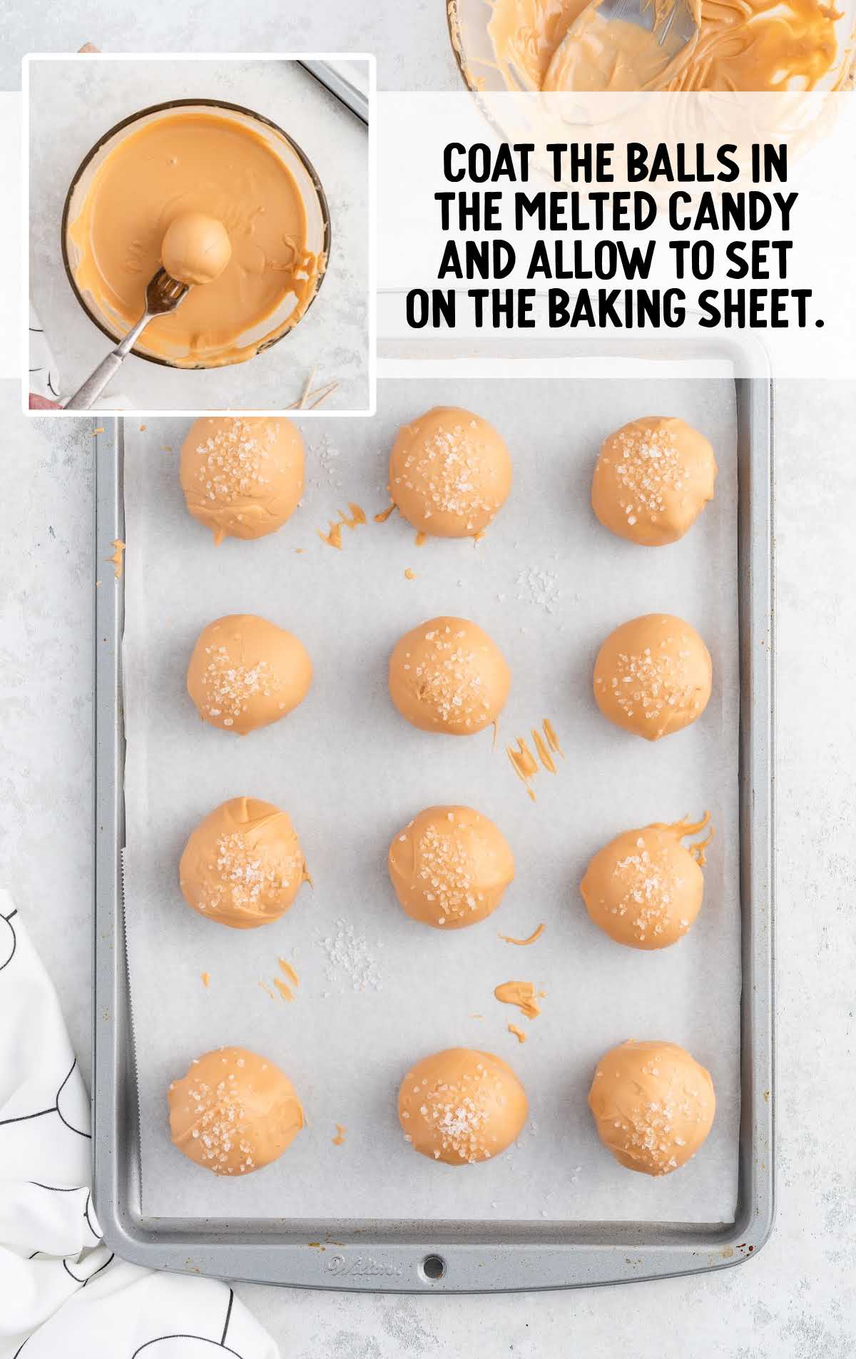 cheesecake bites coated with the melted candy on a baking sheet