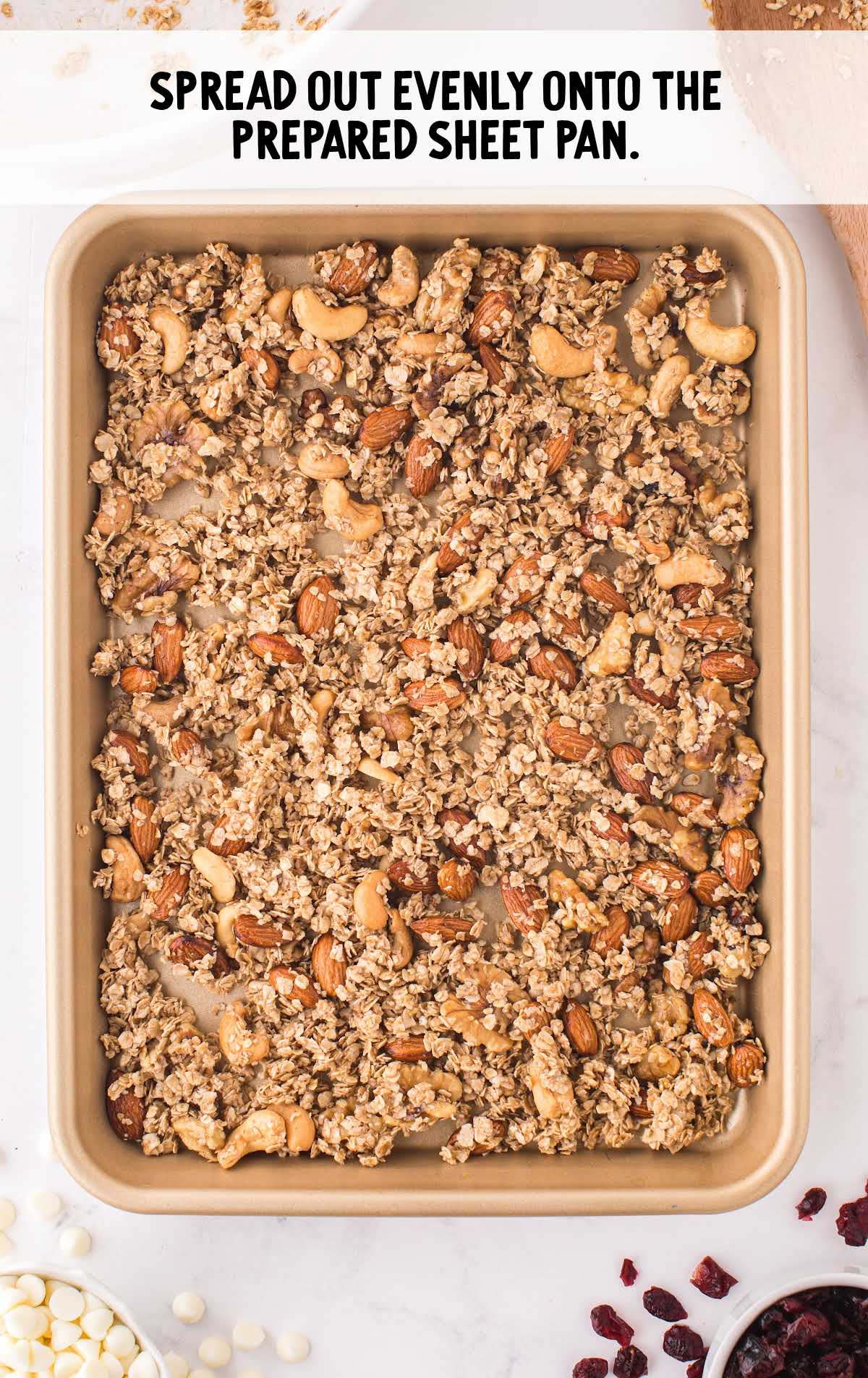 rolled oats mixture spread out on a sheet pan