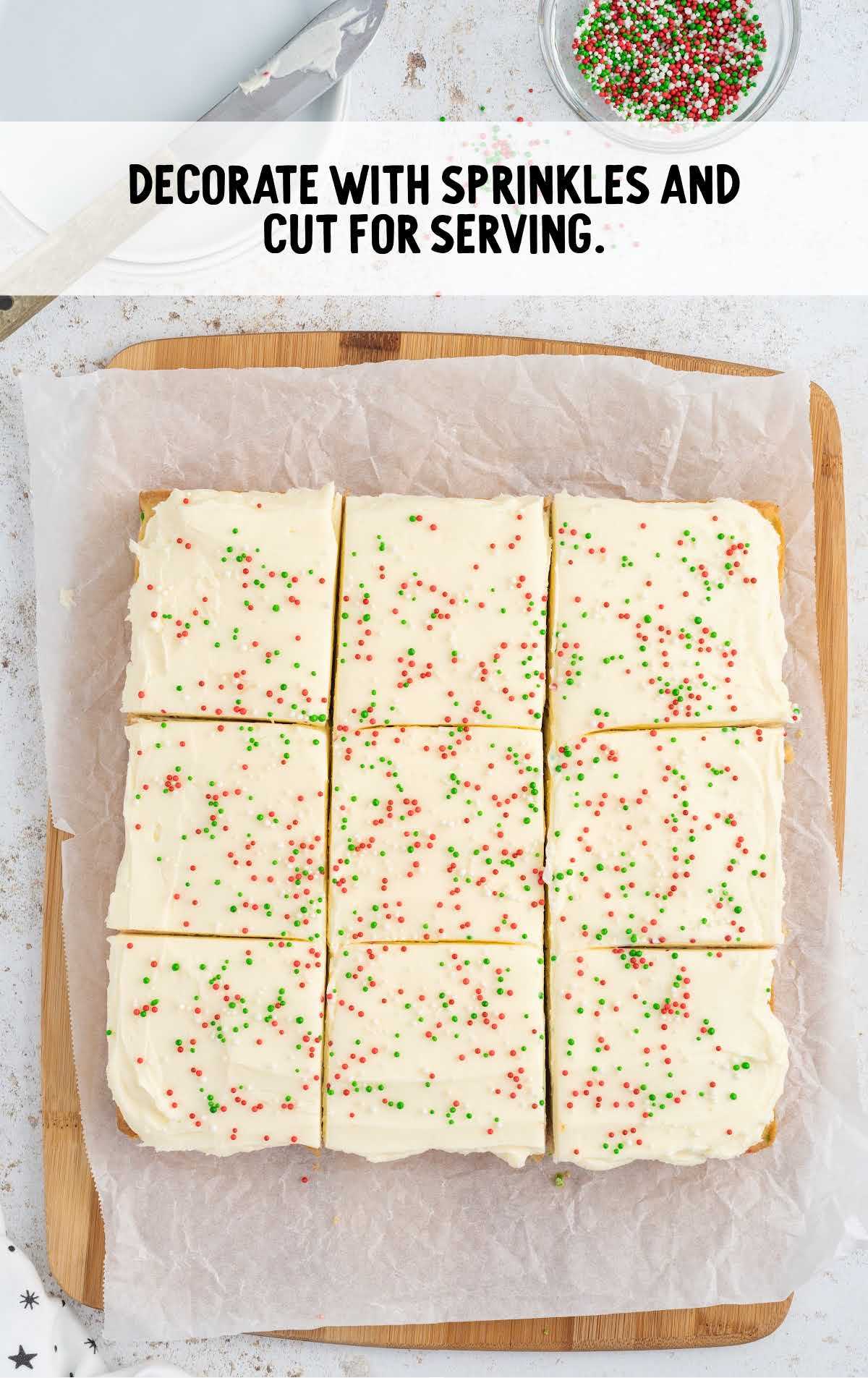 decorate cookie bar with sprinkles on a wooden board