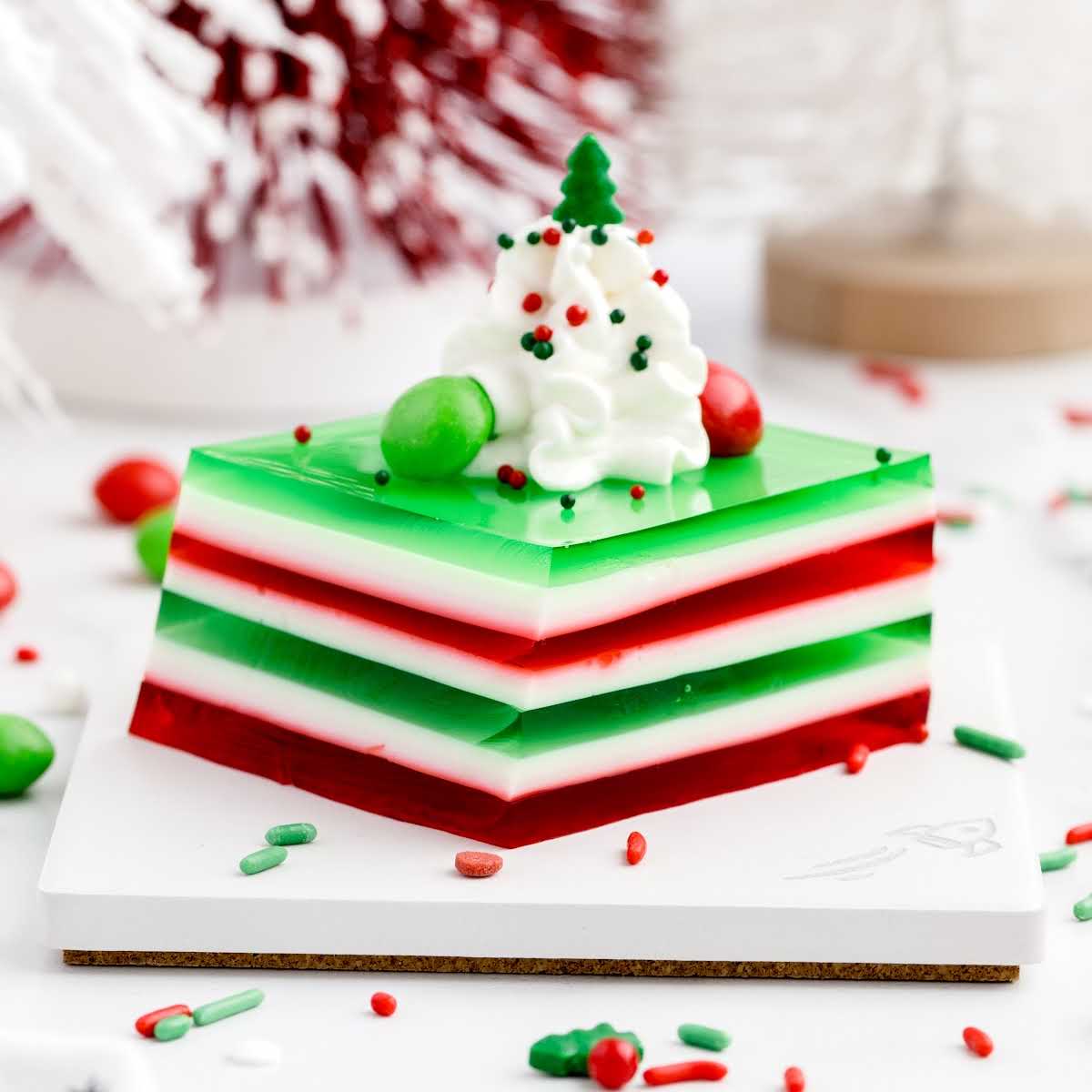 a close up shot of Holly Jolly Jello Shots on a stand