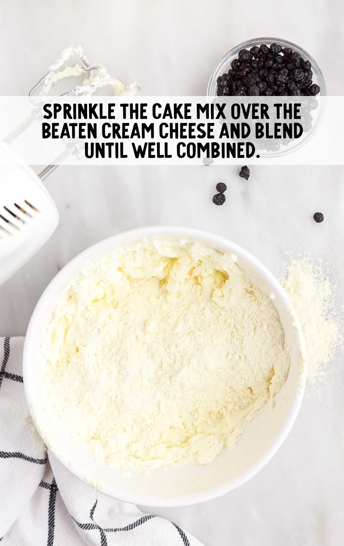 cake mix sprinkled over the cream cheese and combined in a bowl