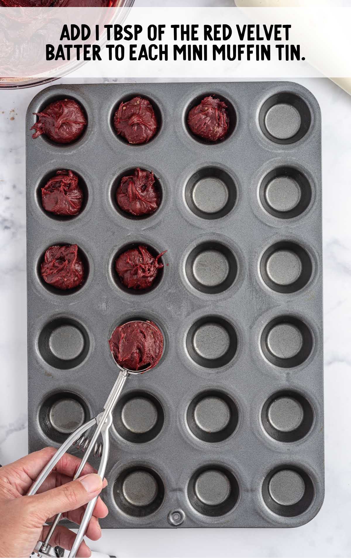 red velvet batter added to the muffin pan