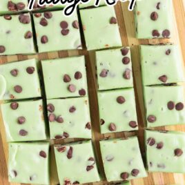 overhead shot of Mint Chocolate Chip Fudge stacked on top of each other on a wooden board
