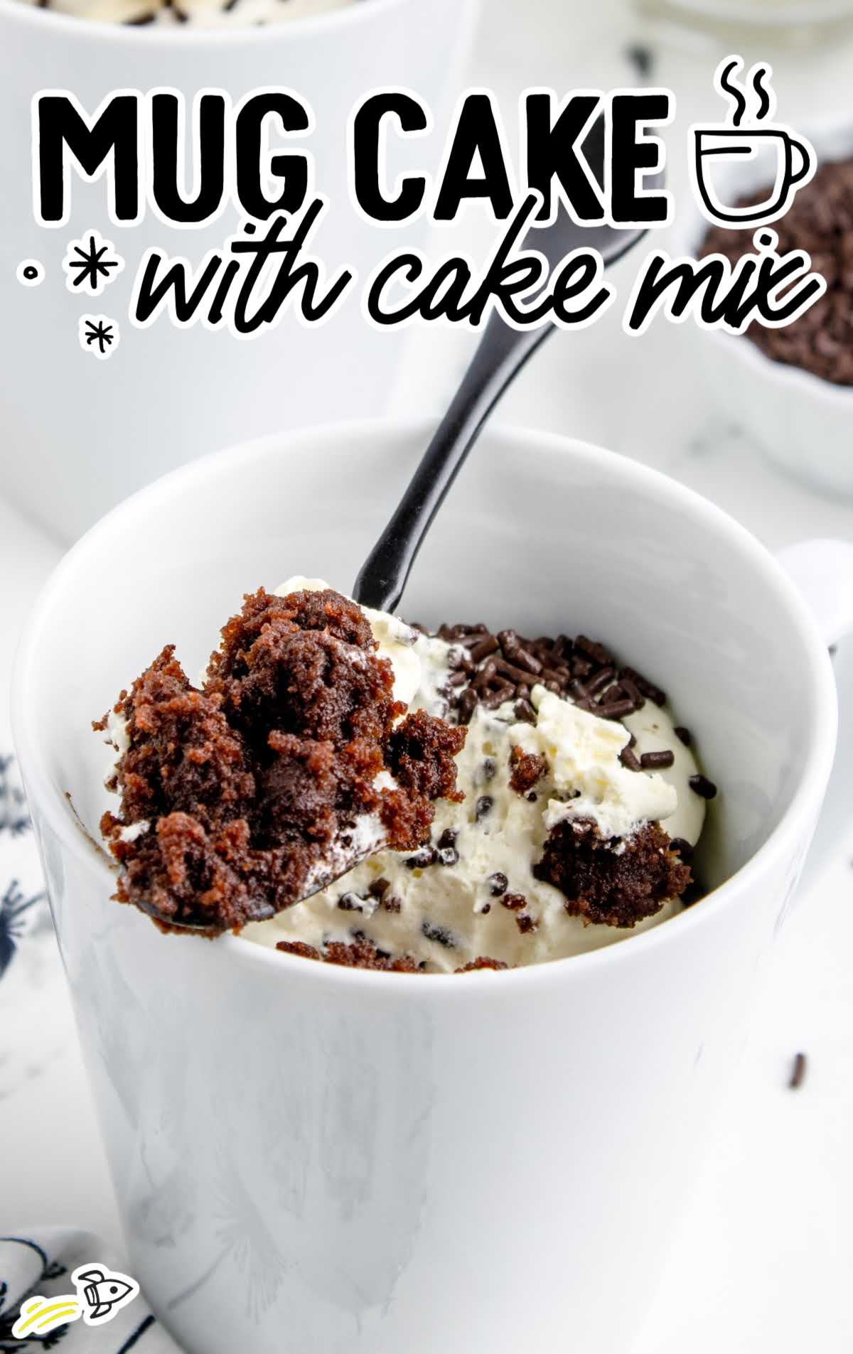 close up shot of Mug Cake with Cake Mix in a cup with a fork grabbing a piece