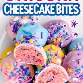 a overhead shot of Unicorn Cheesecake Bites on a plate with one split in half