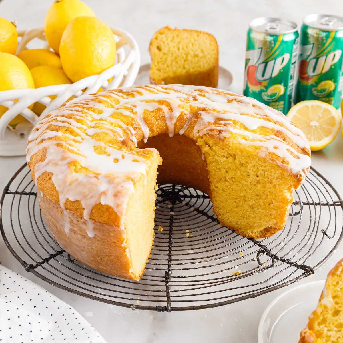 a close up shot of 7Up Cake on a cooling rack with slices taken out
