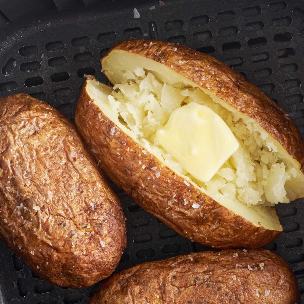 overhead shot of Air Fryer Baked Potatoes on a air fryer