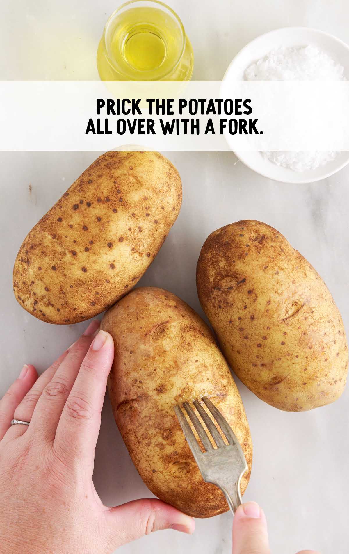 potatoes pricked with a fork