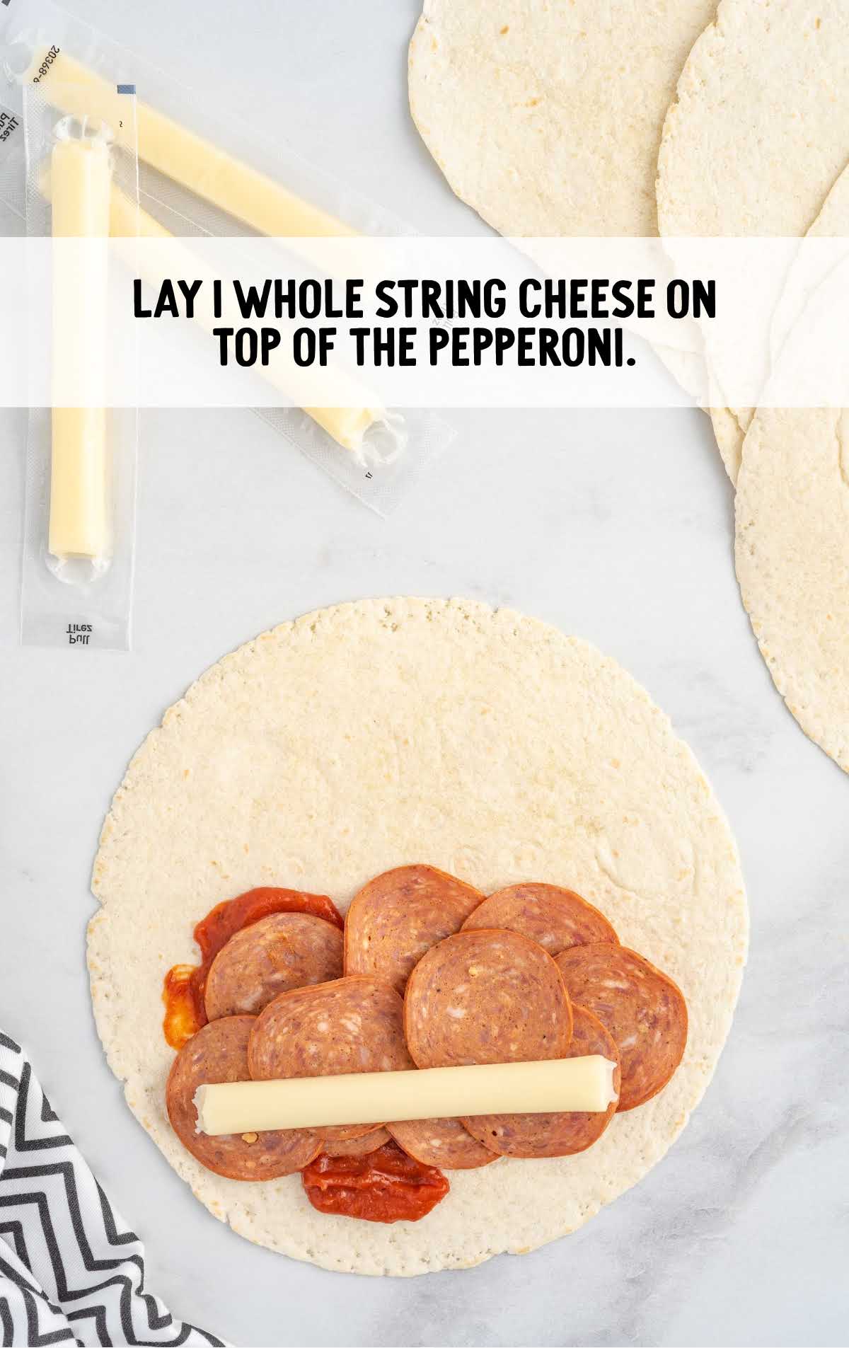 string cheese laid on top of the pepperoni