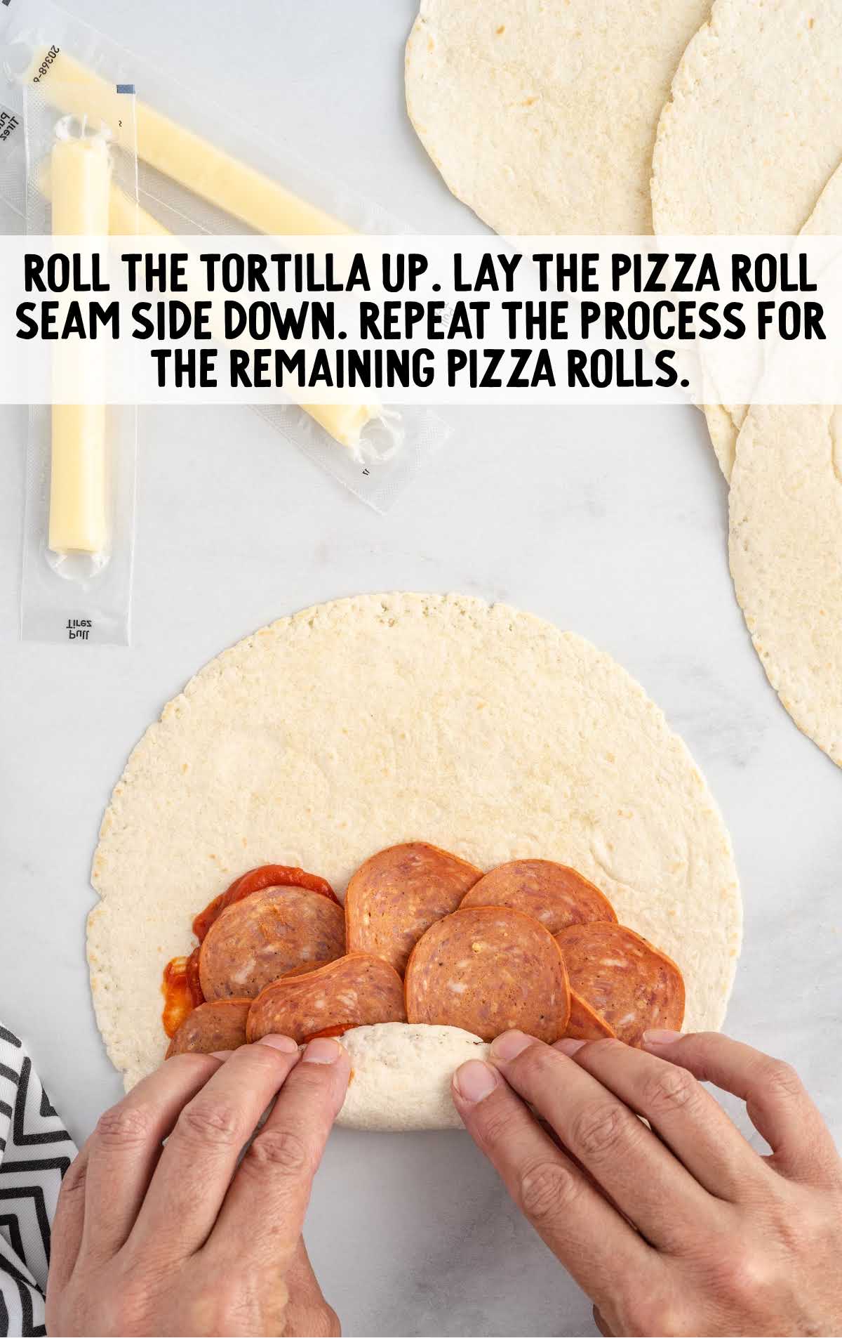 tortilla rolled and lay the pizza roll seam down