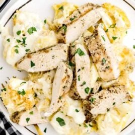 a overhead shot of Asiago Tortellini Alfredo with Grilled Chicken on a plate