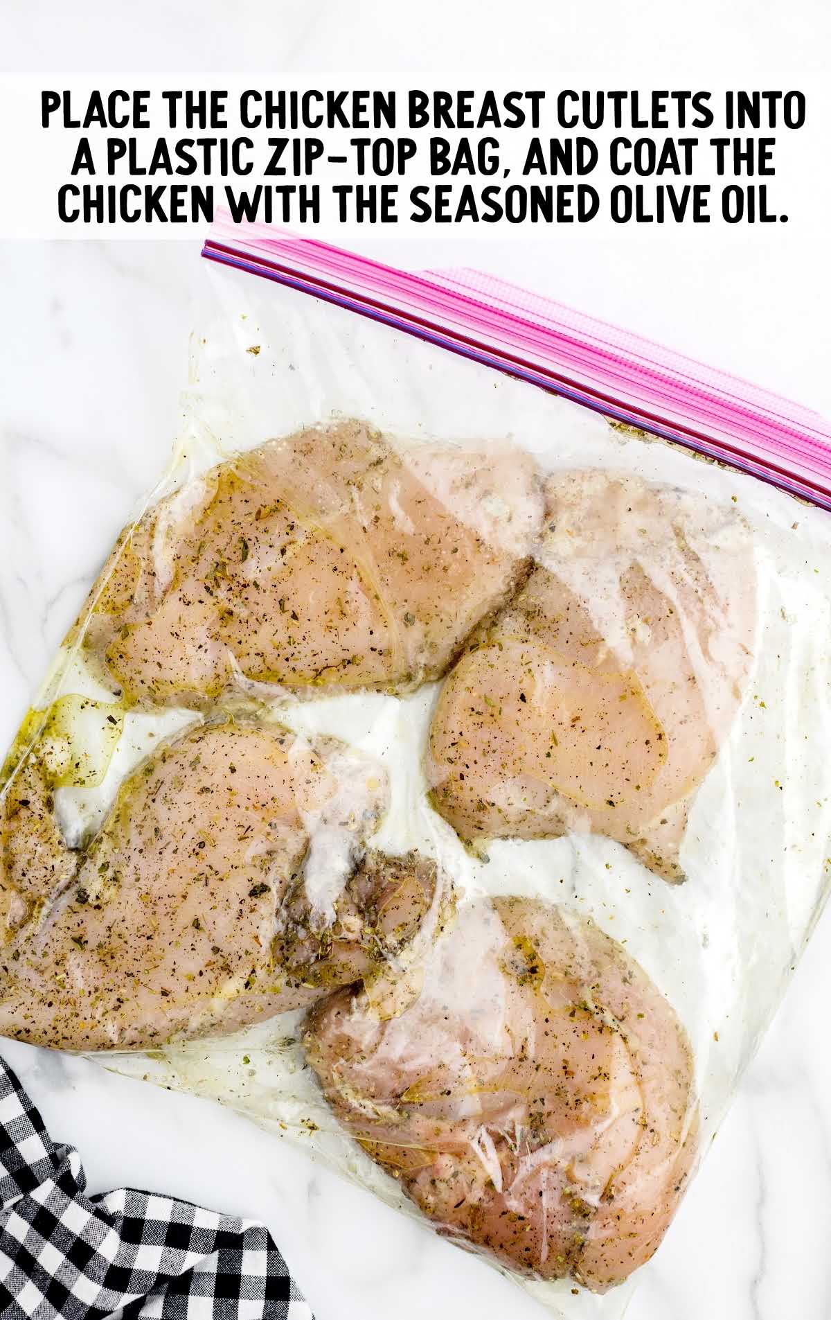 chicken breast seasoned with olive oil in a zip loc bag