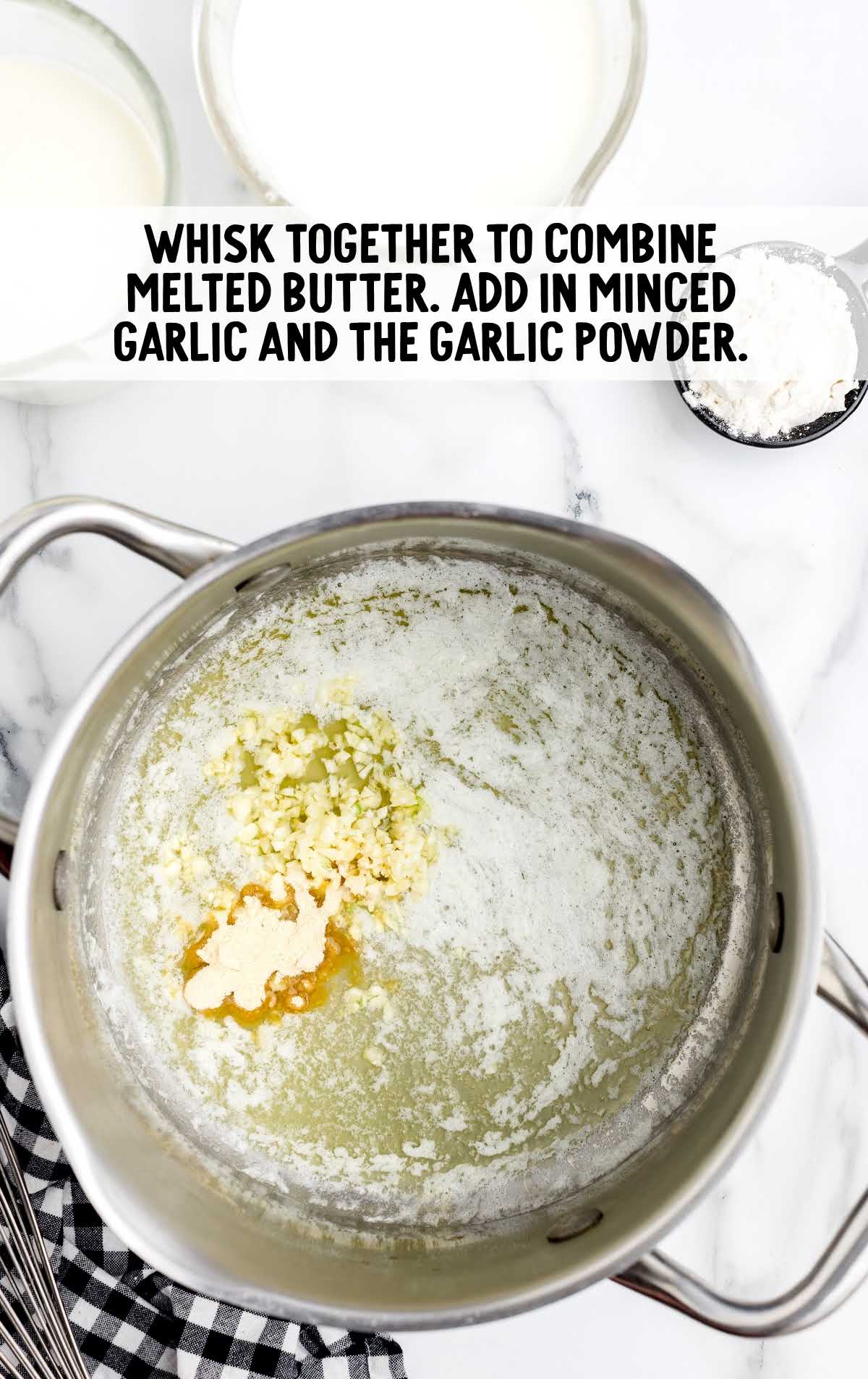 melted butter, garlic and garlic powdered whisked in a pot