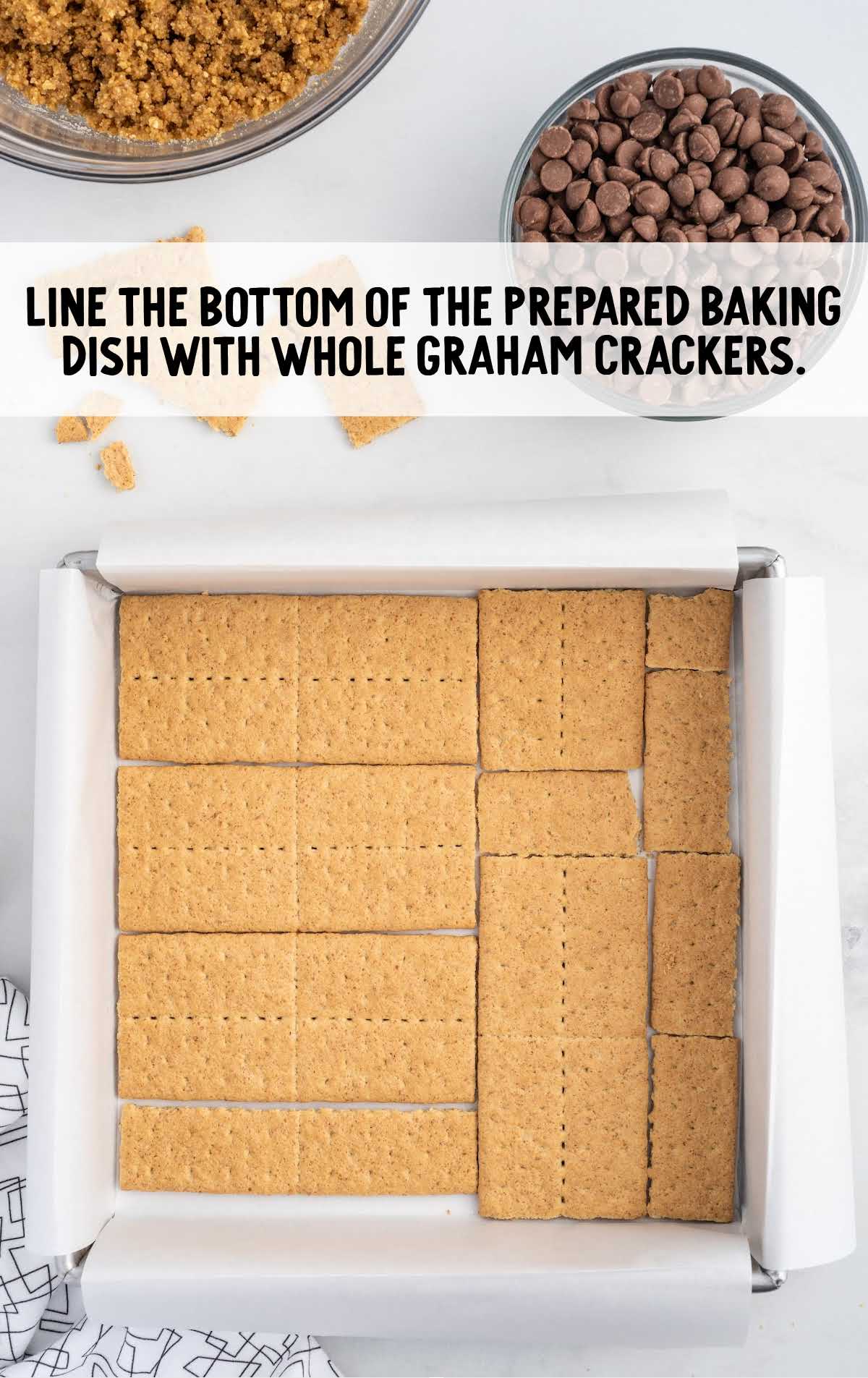 graham crackers lined on the bottom of the baking dish