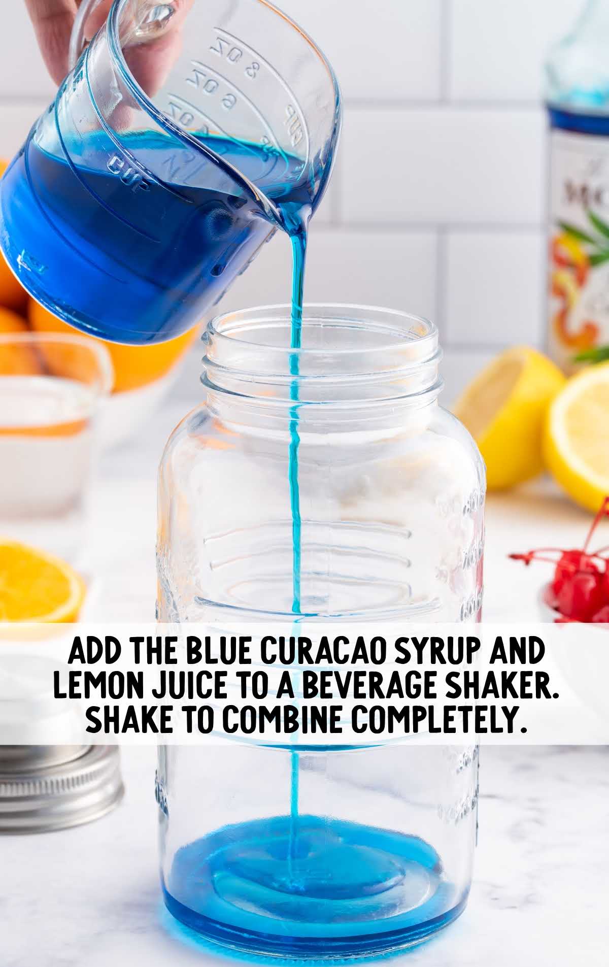 blue curacao syrup and lemon juice added to the shaker