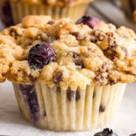 a close up shot of a Blueberry Chocolate Chip Muffin