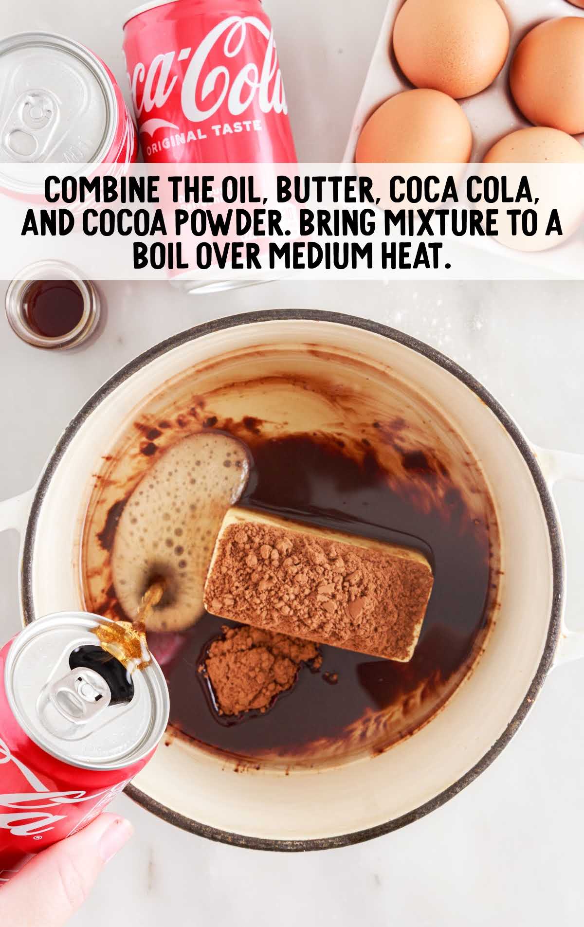 oil, butter, cola cola and cocoa powder combined in a bowl