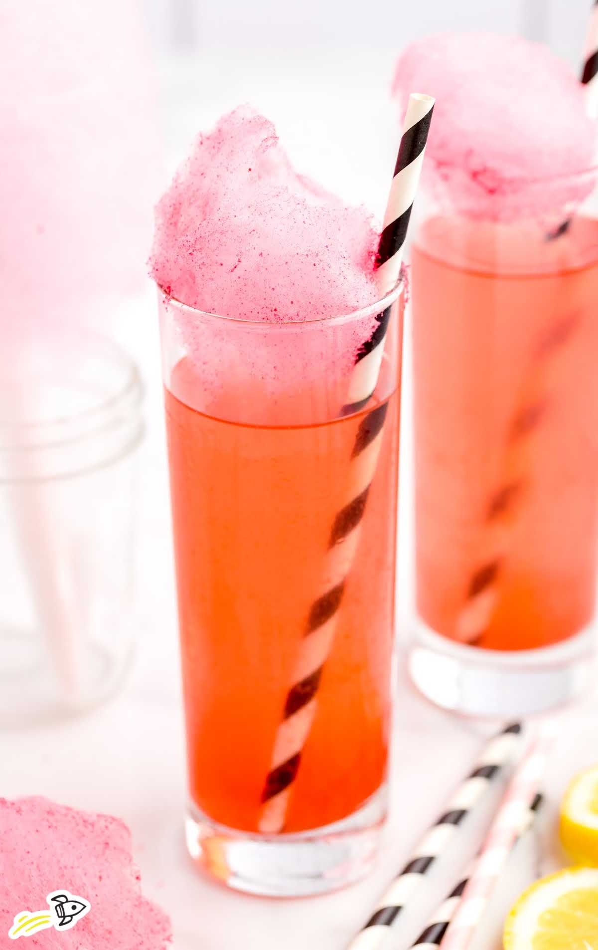 a close up shot of Cotton Candy Cocktails topped with cotton candy