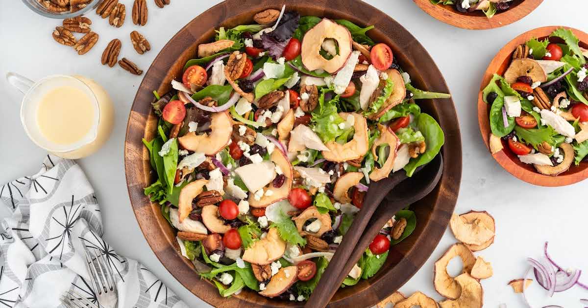 overhead shot of Fuji Apple Panera Salad in a wooden bowl