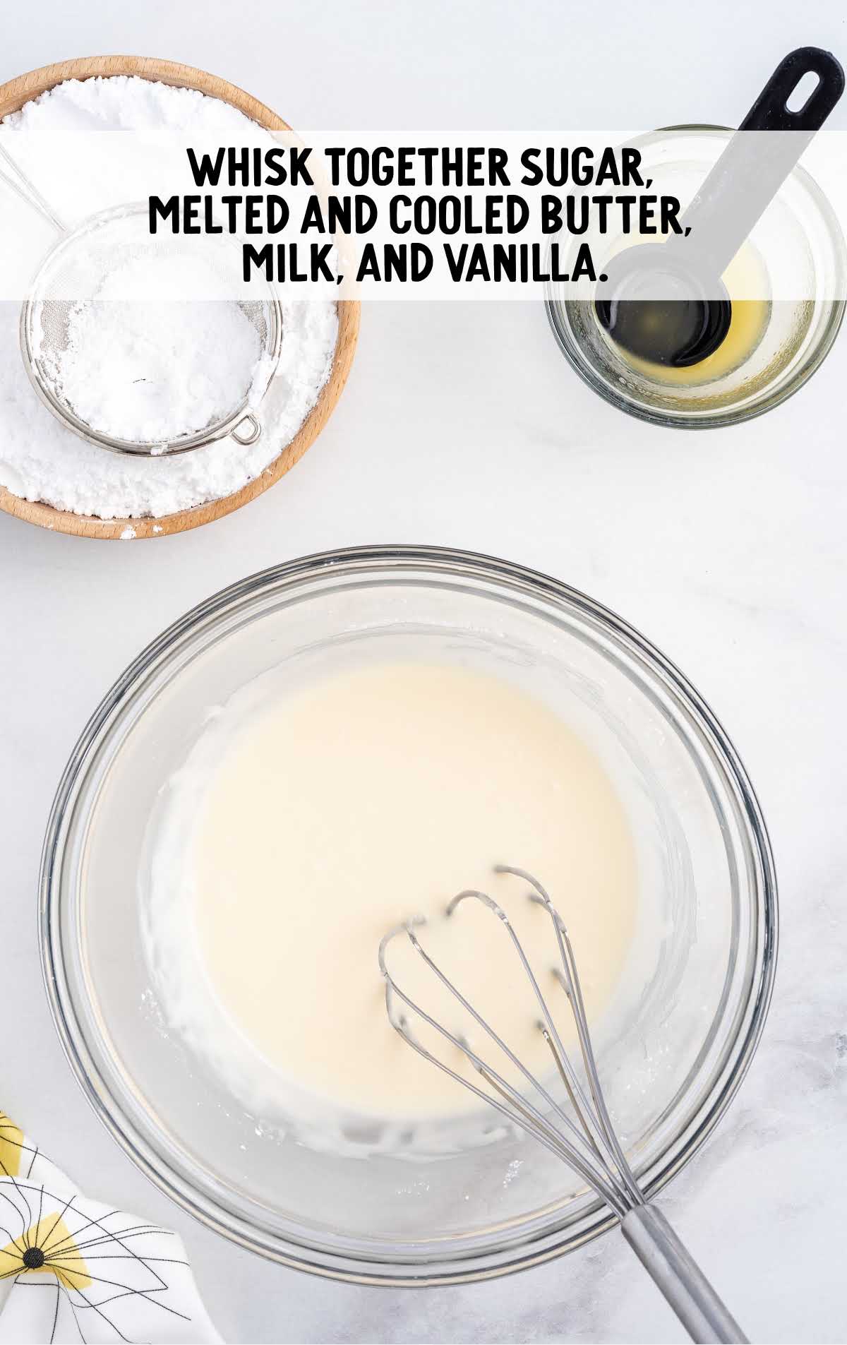 sugar, melted and cool butter, milk, and vanilla whisked in a bowl