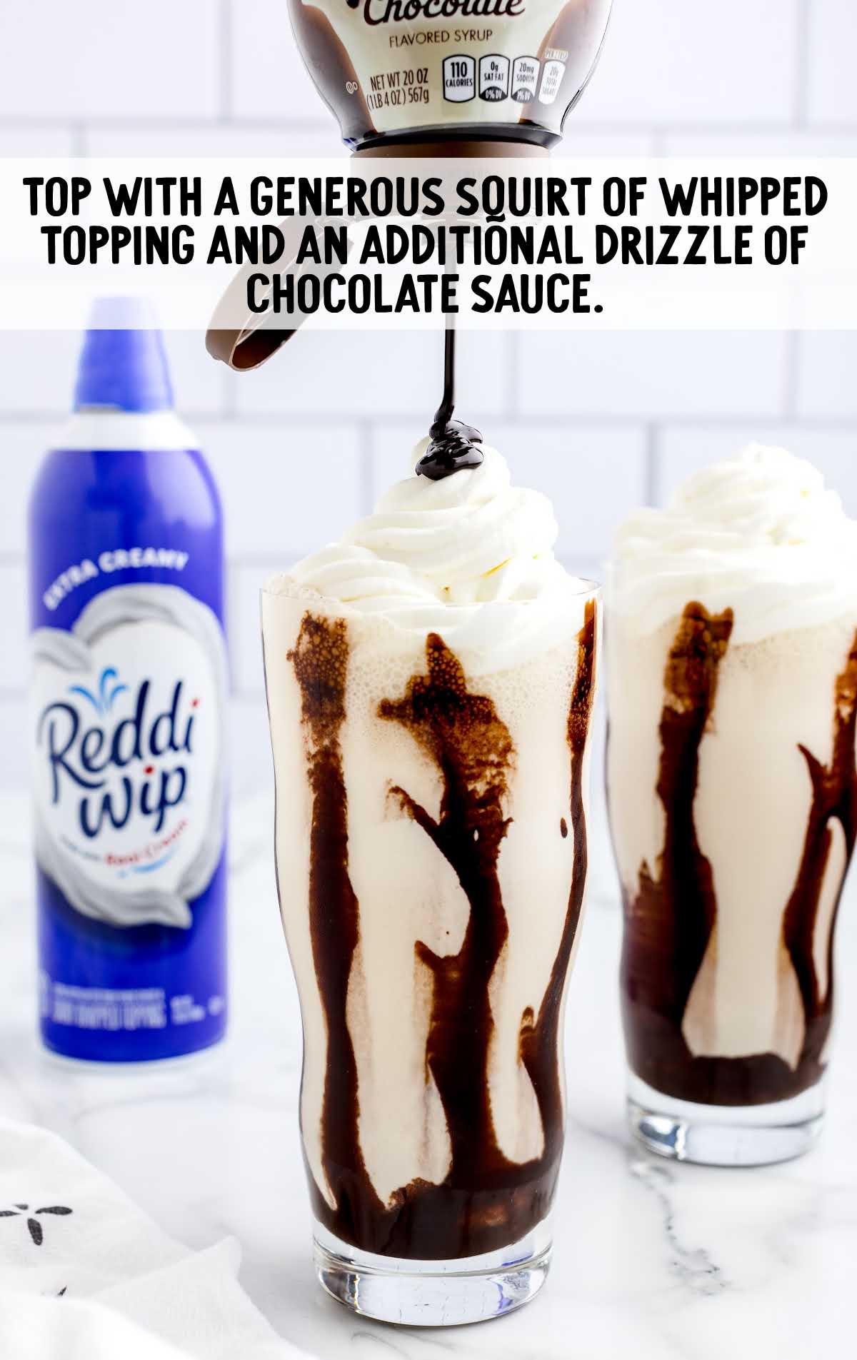 whipped topping and chocolate sauce topped on top of the drink