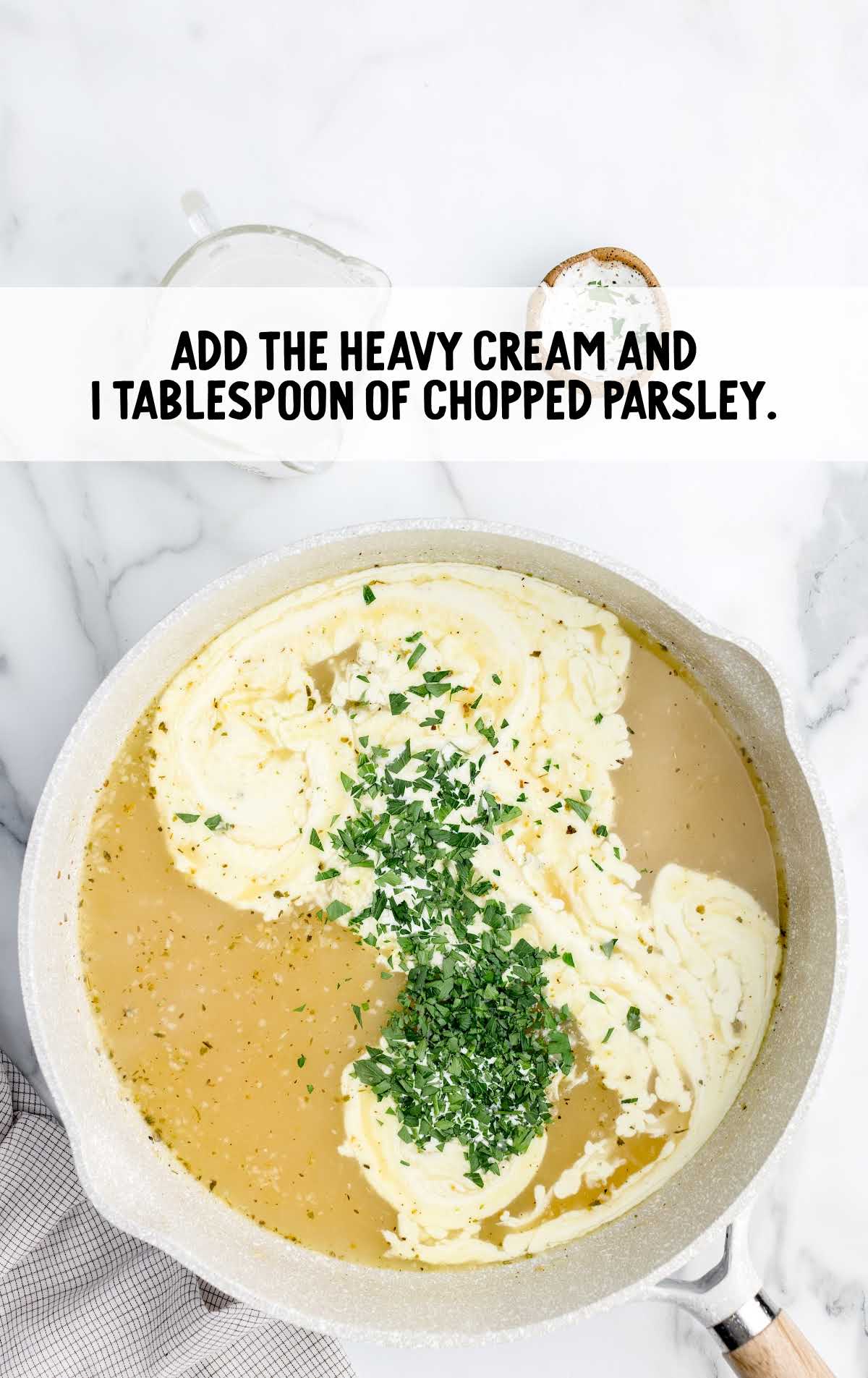heavy cream and parsley added to a pan