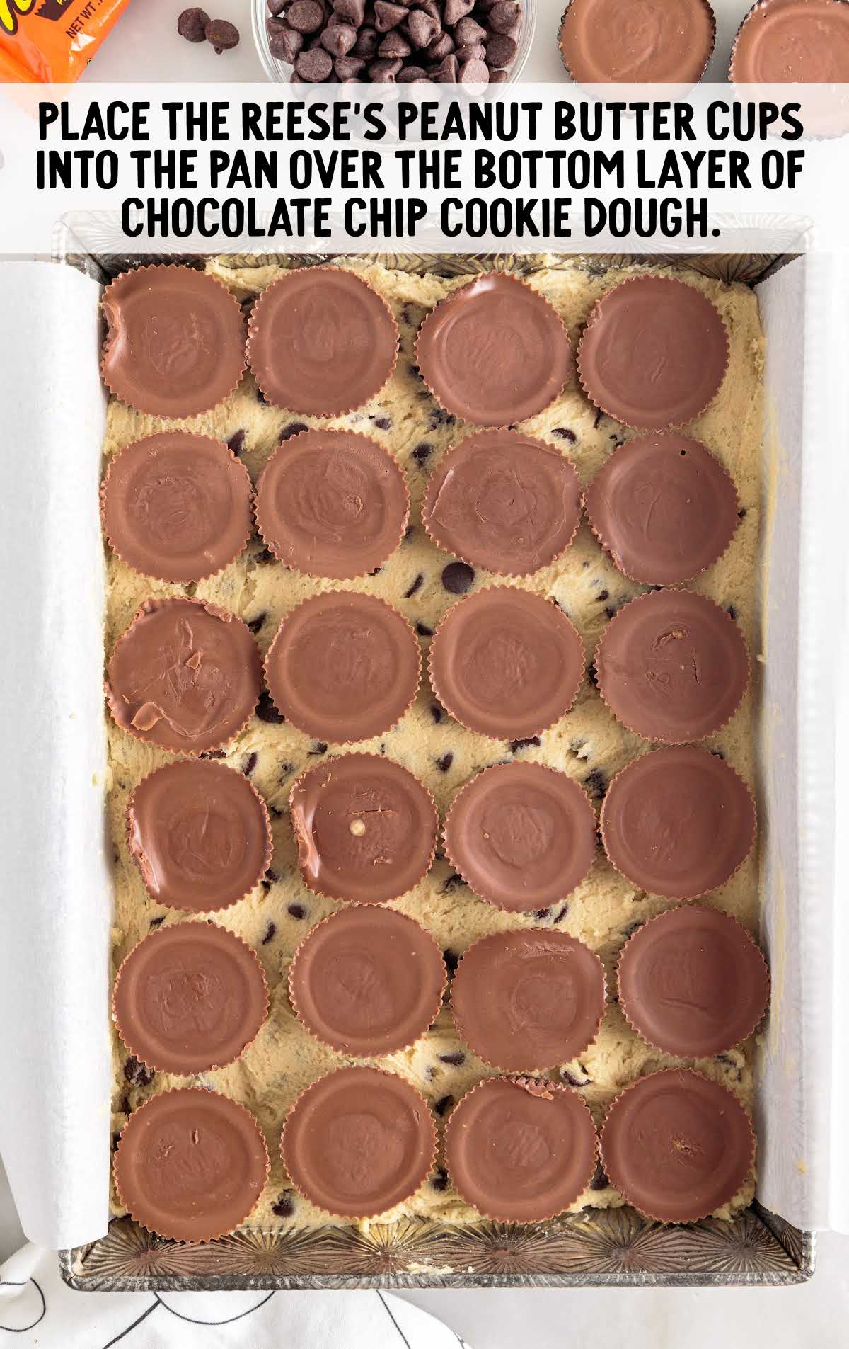 Reese's peanut butter cups placed into the bottom of a pan