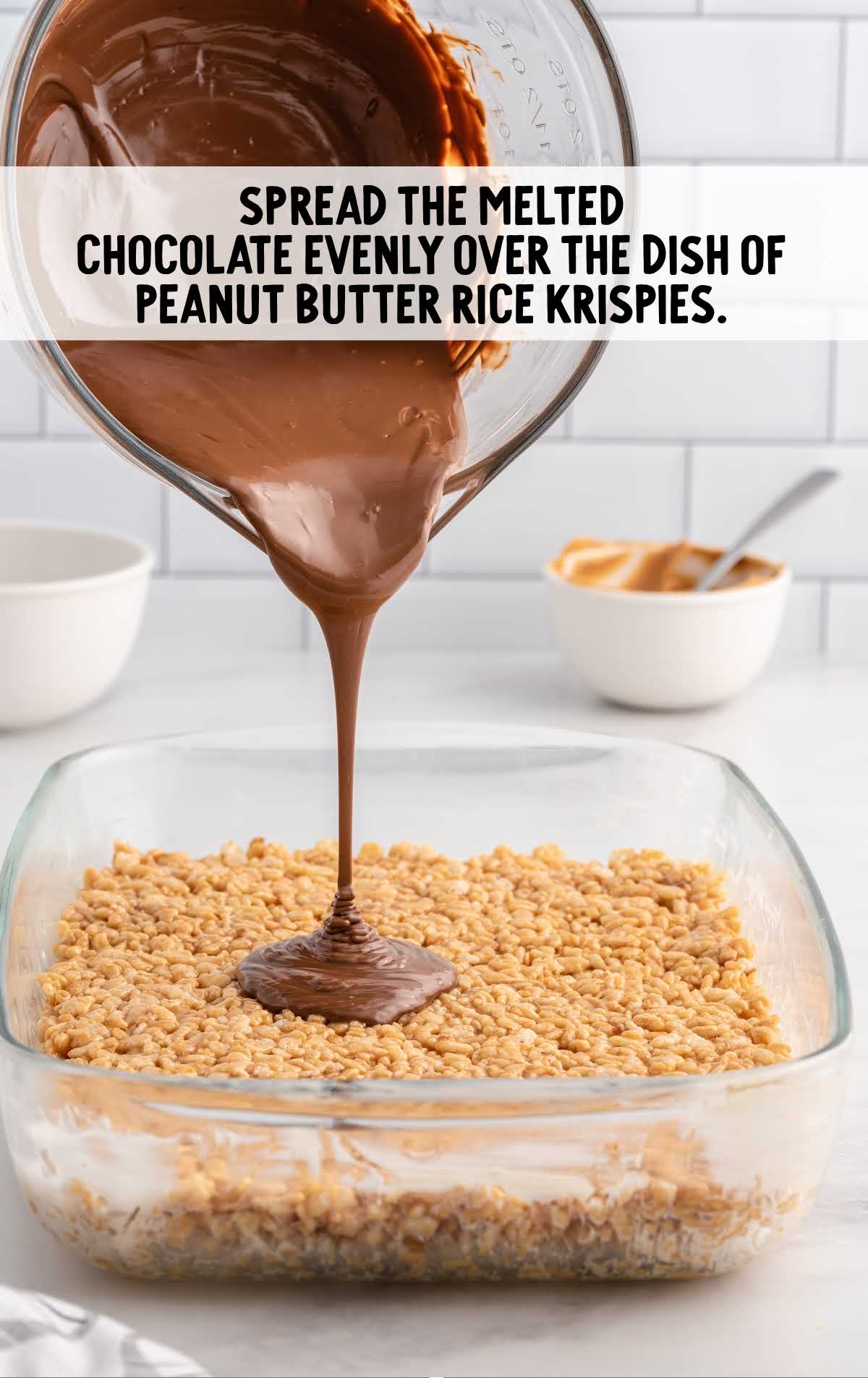 melted chocolate spread over the rice krispies