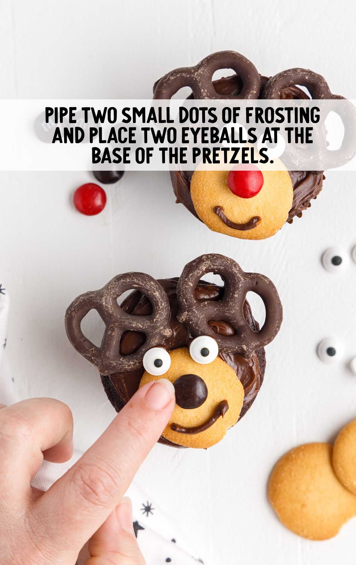 use frosting to place the two eyeballs