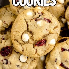 close up shot of White Chocolate Cranberry Cookies stacked on top of each other