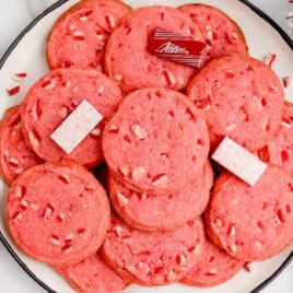overhead shot of Candy Cane Shortbread Cookies stacked on a plate