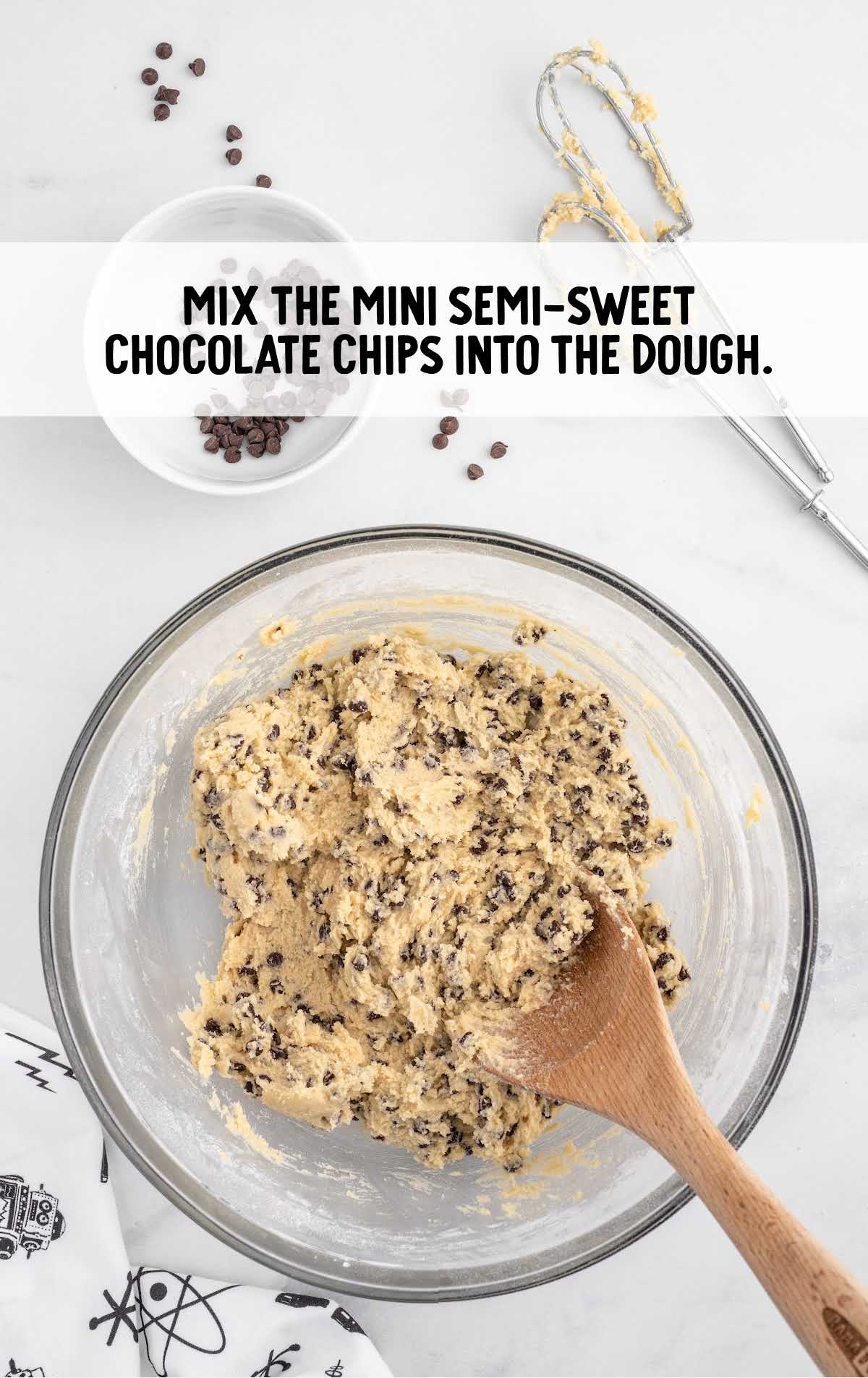 mini semi sweet chocolate chips combined with the dough in a bowl