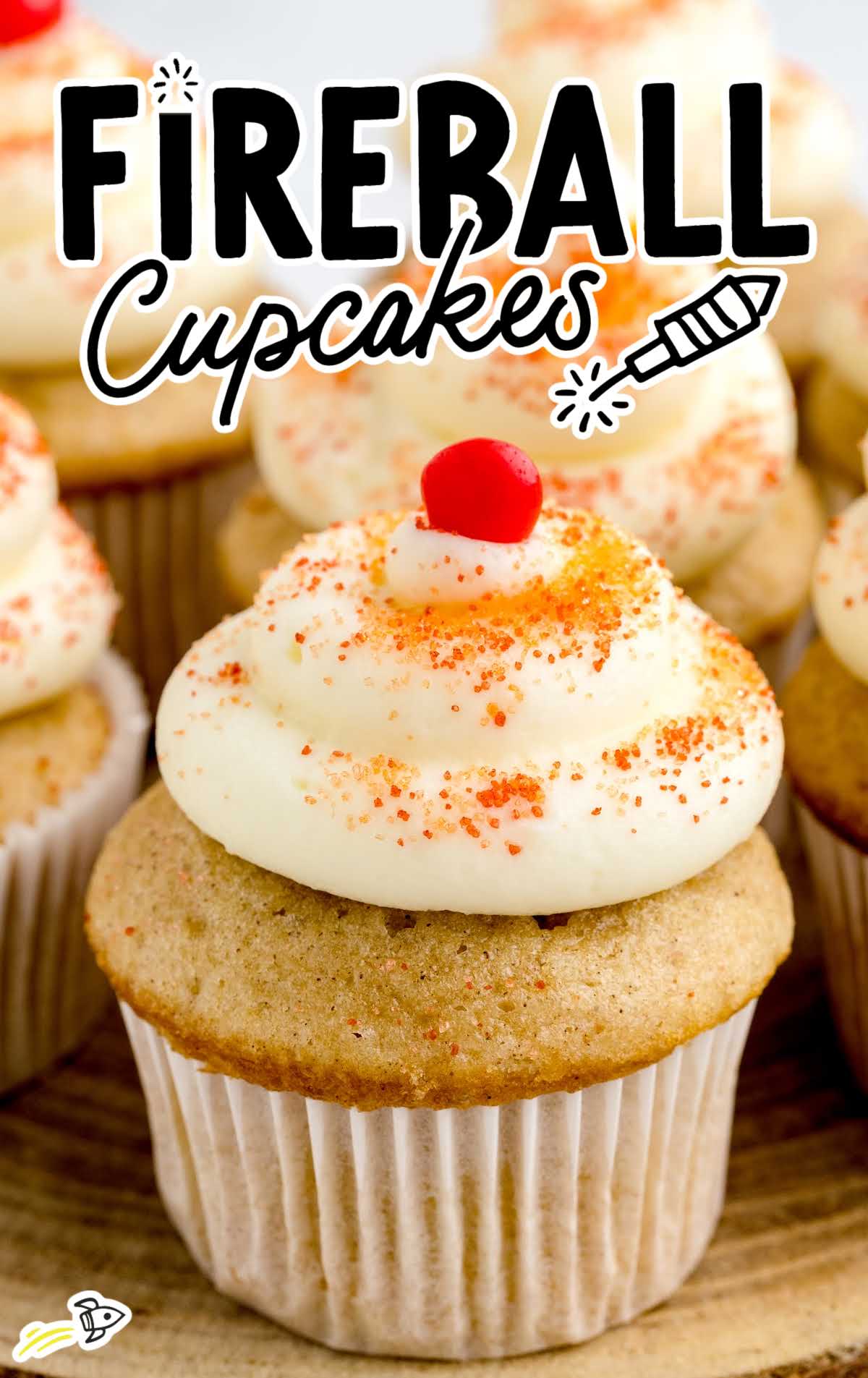 a close up shot of a Fireball Cupcakes on a wooden stand