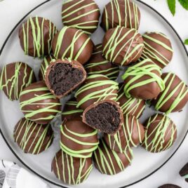 overhead shot of Mint Oreo Truffles on a plate with one split in half