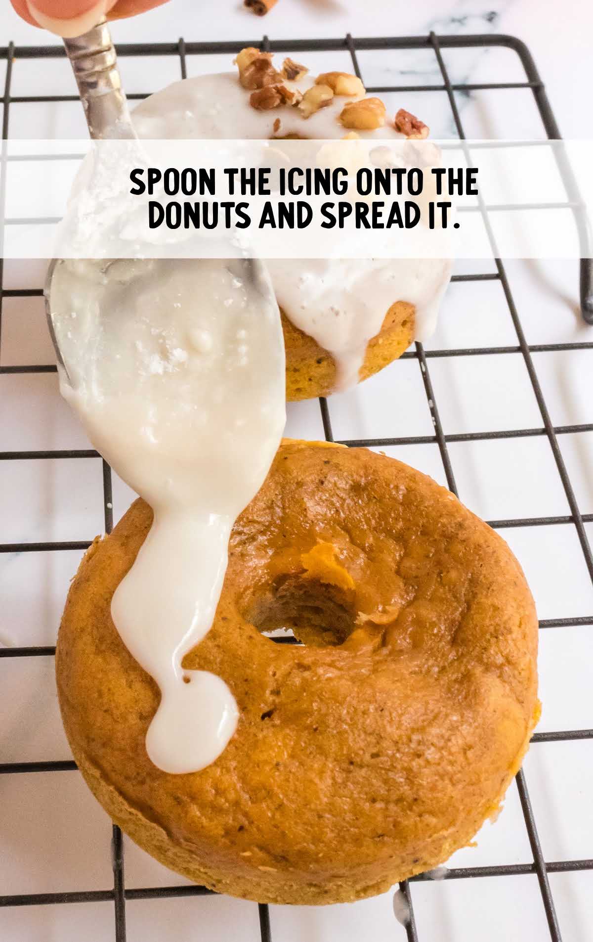 icing spooned onto the donut and spread it