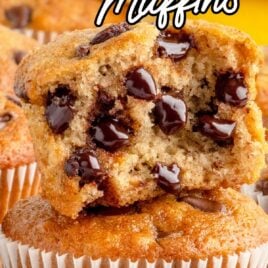 a close up shot of Banana Chocolate Chip Muffins with one having a bite taken out of it