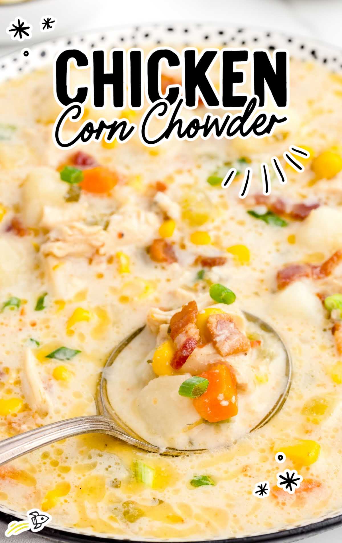 overhead shot of Chicken Corn Chowder with a spoon grabbing a piece
