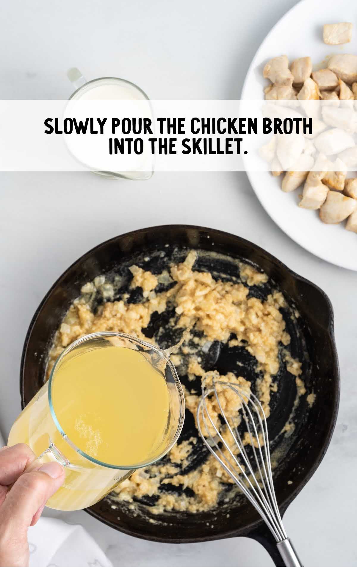 chicken broth poured into the skillet