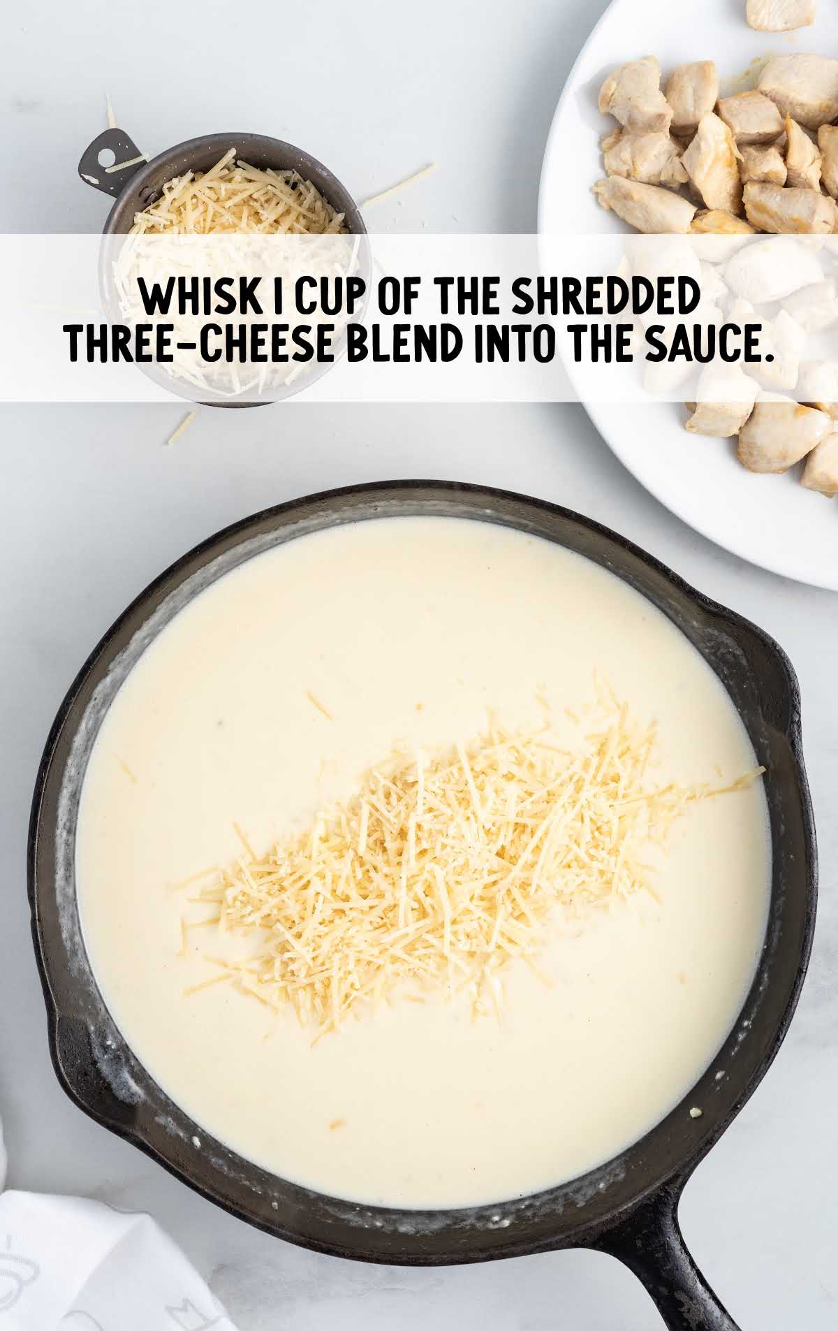 shredded three cheese blend whisked into the sauce