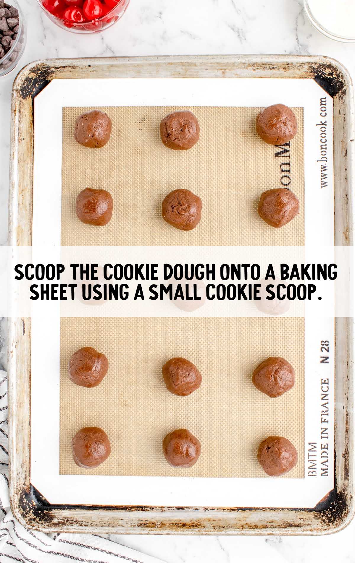 cookie dough scooped onto a baking sheet