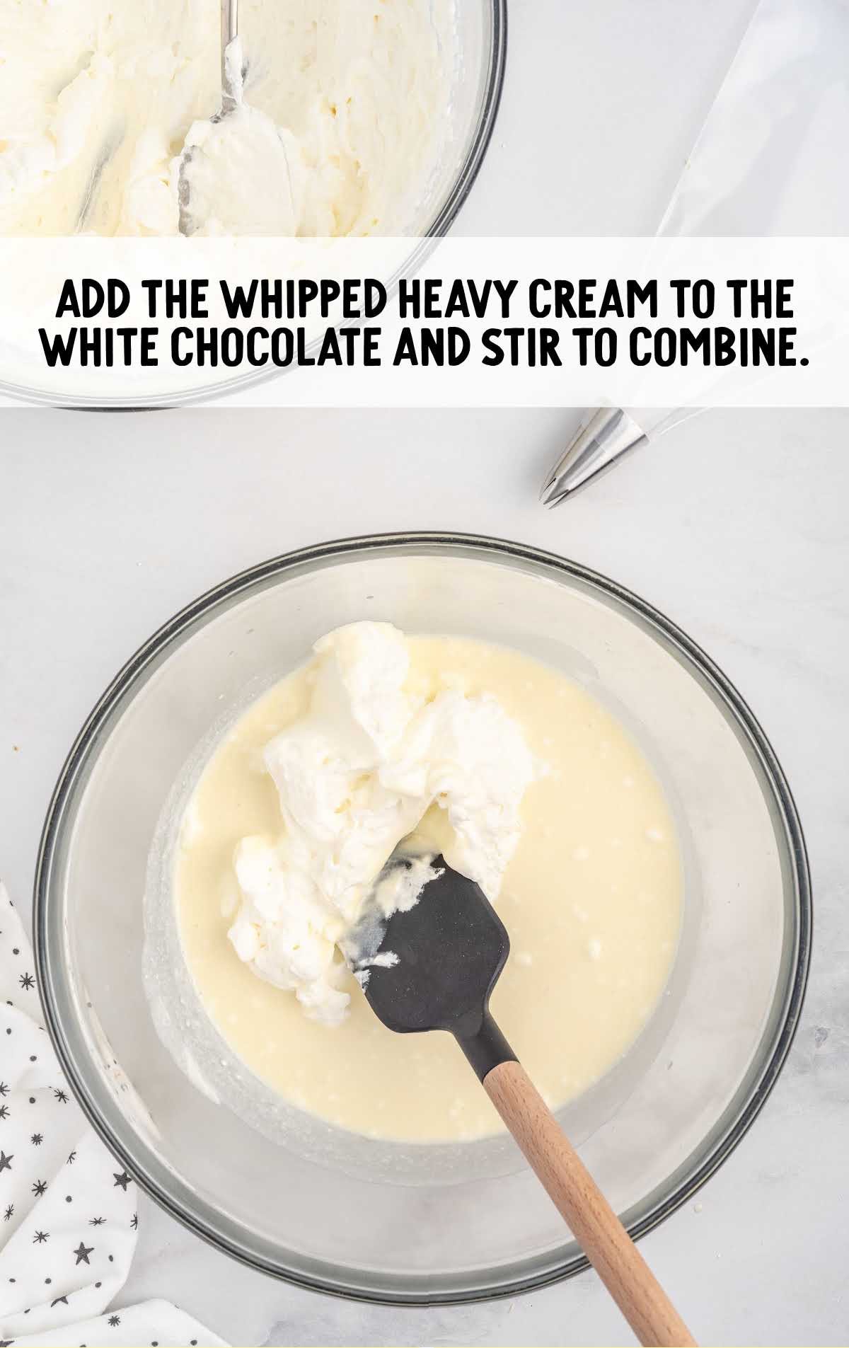 whipped heavy cream added to the white chocolate and stirred in a bowl