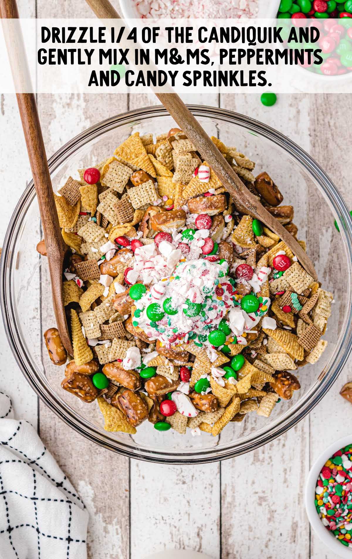 candiquick, m&m's, peppermints and candy sprinkled over the chex mix