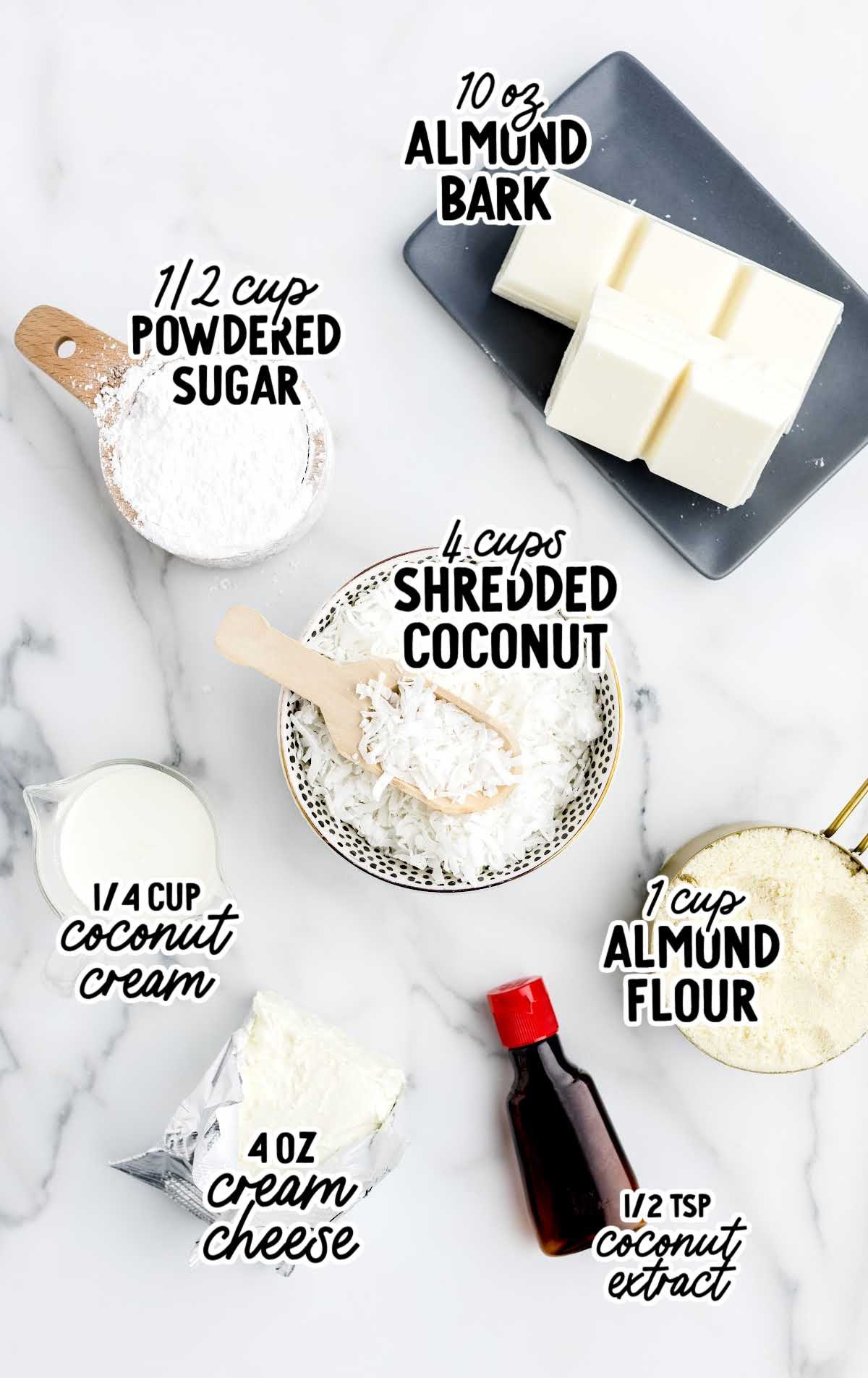 Labeled coconut snowball ingredients including shredded coconut, almond bark, coconut cream, cream cheese, almond flour, and powdered sugar.