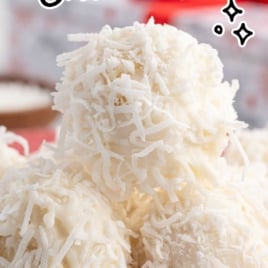 Stack of coconut snowballs on a red plate with text overlay promoting this no-bake Christmas treat.